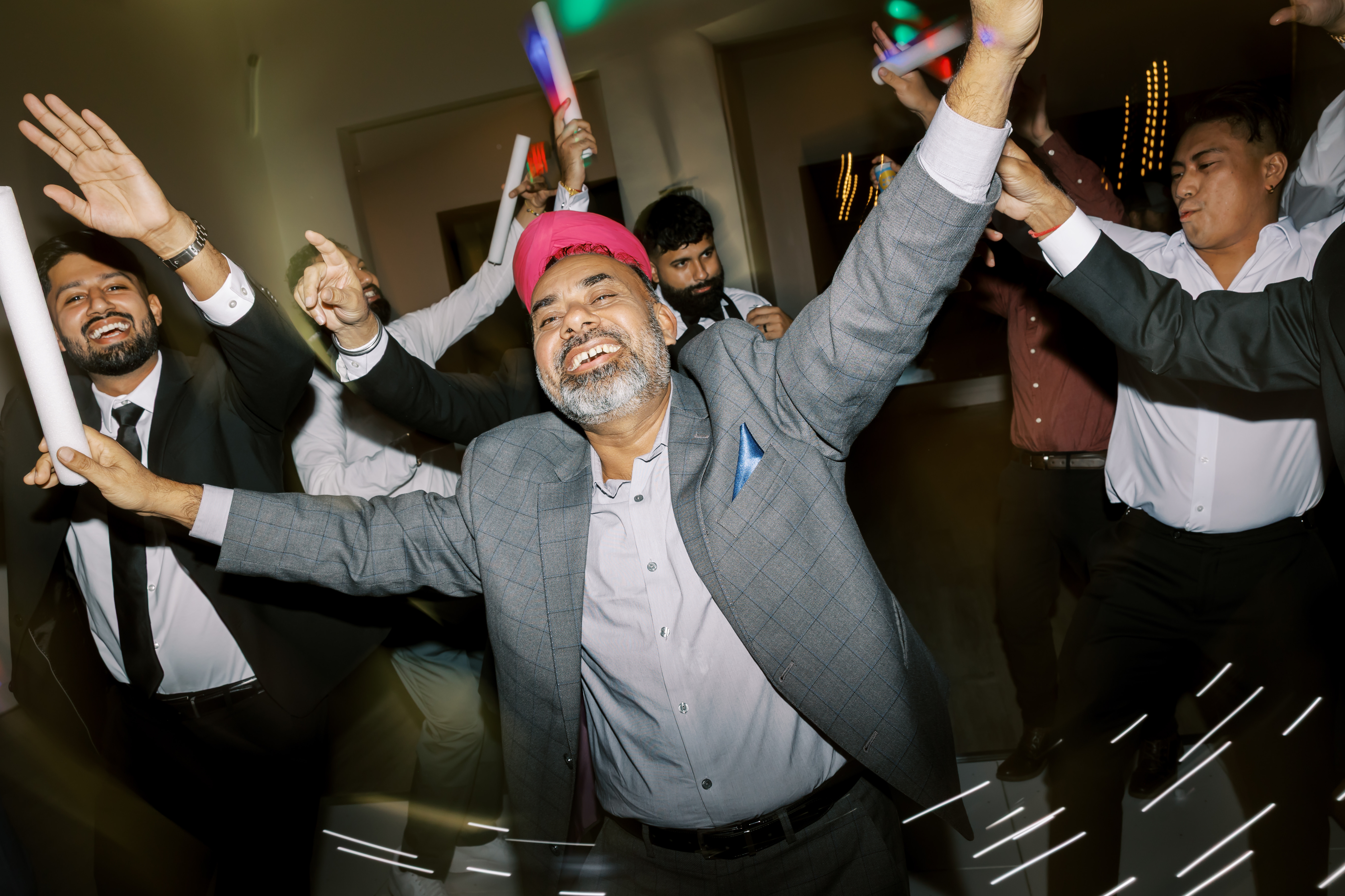 Couple celebrating at their Indian wedding reception with DJ Lakha